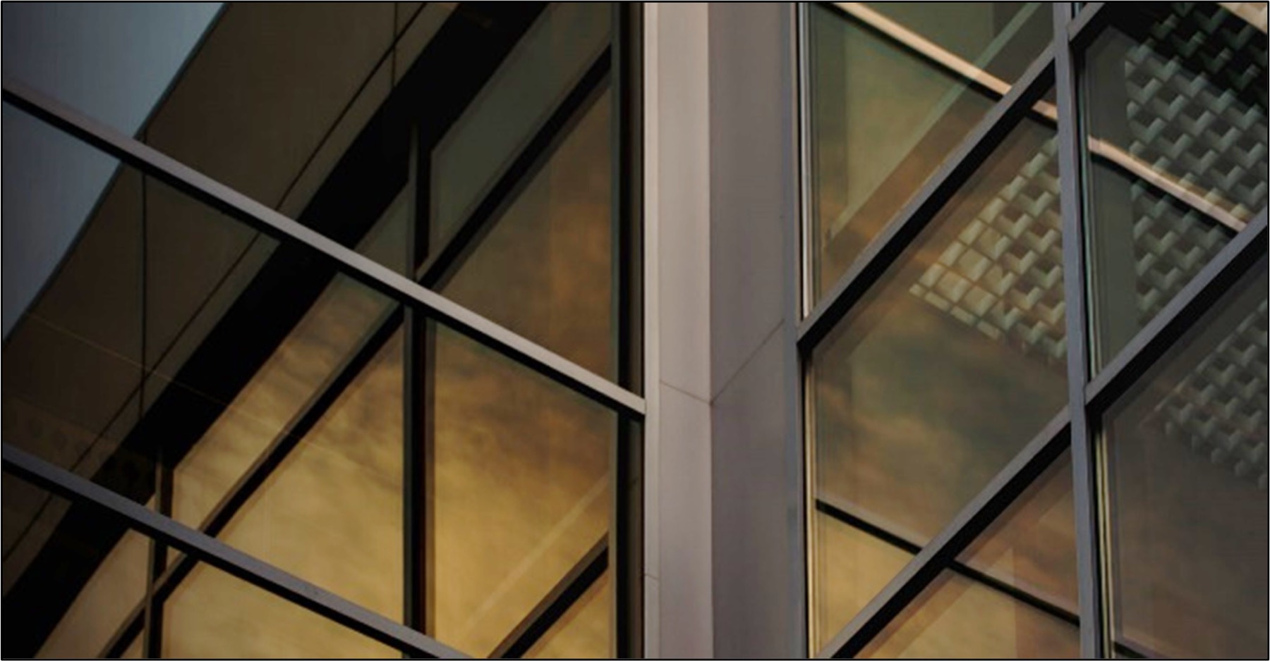 Gold and black glass curtain wall, the abstract image Legacy uses across its proposals