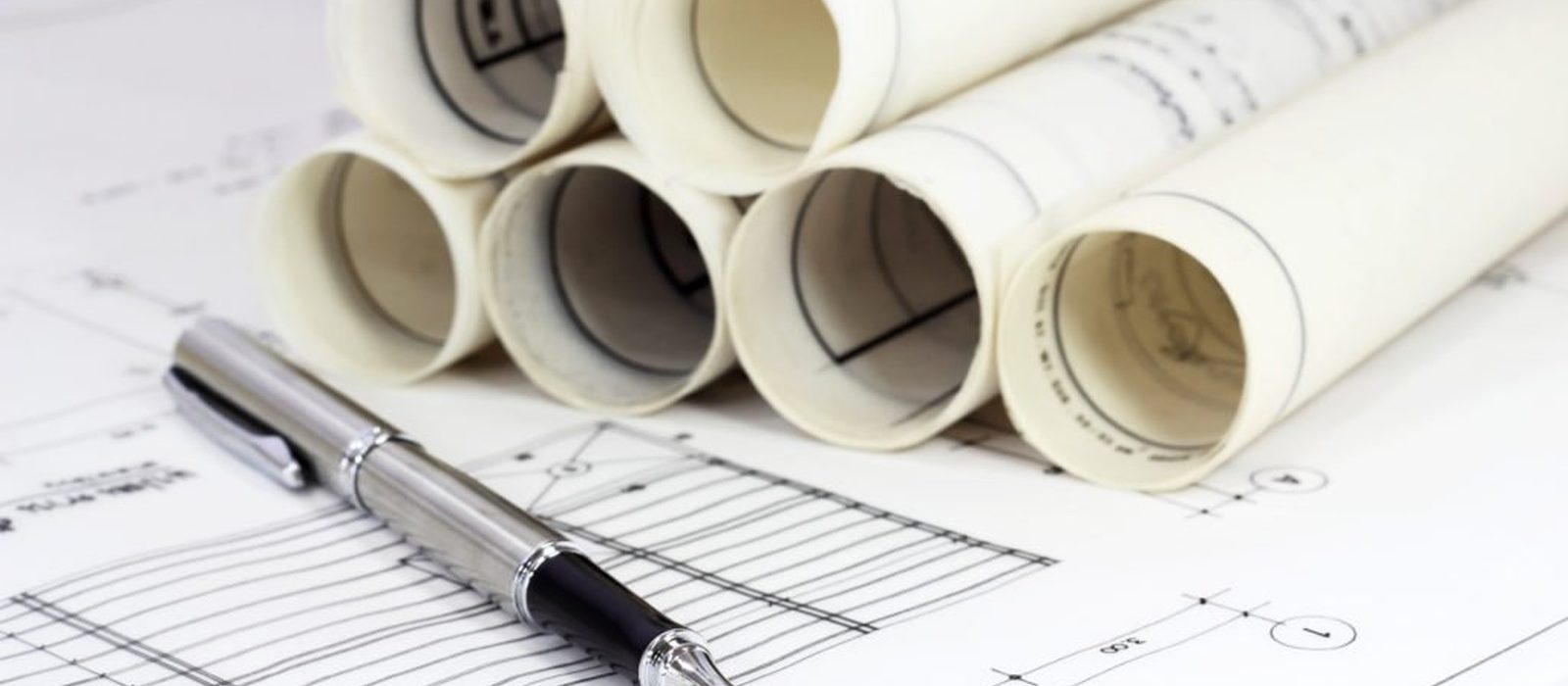Drawings and a construction schedule on a desk